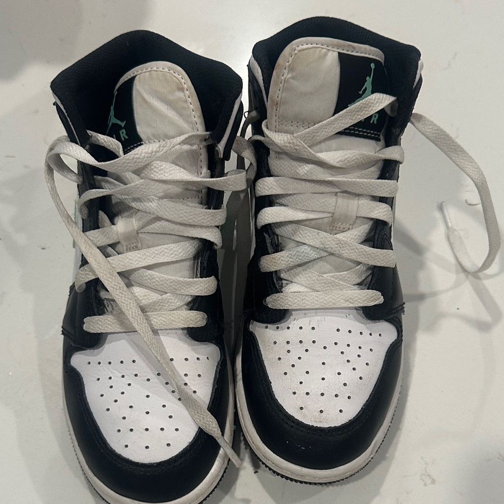 Nike Air Jordan’s Black and White High-Top Sneakers